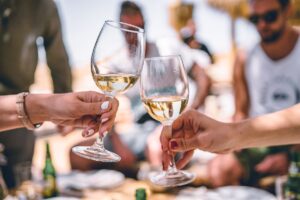 People cheering with wine for the Vineyard & Winery Tours & Tastings in Kent 2023 blog