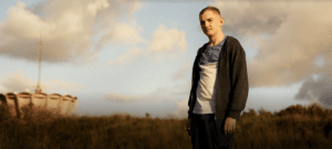 Person standing outside new film releases in cinemas in Kent and Christy from Altitude Film