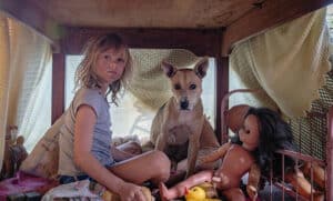 A girl with a dog and a doll for New film releases for cinemas in Kent and Don't Let's Go To The Dogs Tonight - Sony Pictures