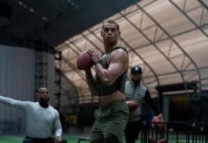 Man in a vest holding a ball for New film releases for cinemas in Kent and Him from Universal Pictures