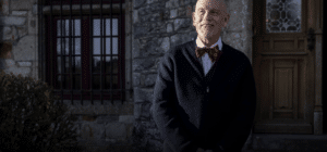 Man in a bow tie and a jacket smiling for New film releases for cinemas in Kent and Mr. Blake, At Your Service - Vertigo Releasing