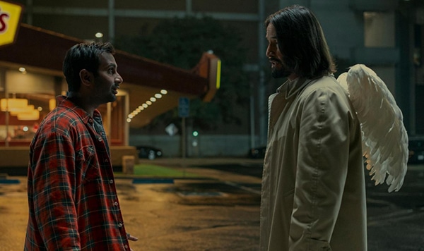 Two men one black and one white with angel wings facing each other for new films for cinemas in Kent and Good Fortune from Lionsgate