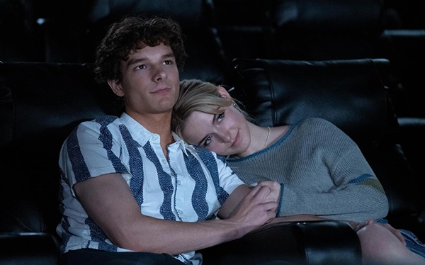 A young man in a stripped top sitting next a a young woman who has her head on his shoulder. For new film release in Kent and Regretting You from Paramount Pictures UK