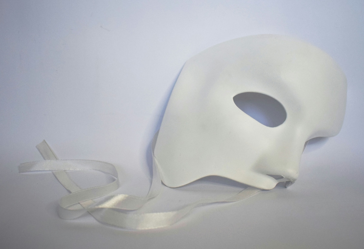 Half of a white mask for Pantomimes in Kent Guide