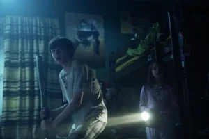 Young boy and girl in a dark room she is holding a torch for the New Film Releases in Kent Guide and Lee Cronin's The Mummy - April 2026