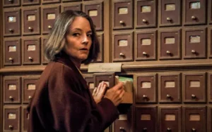 A woman standing next to boxes for new film A Private Life