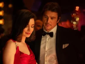 A woman in a red dress standing next to a man in a bow tie, white shirt, black jacket for New Film Releases in Kent and Verity out on the 2nd October 2026