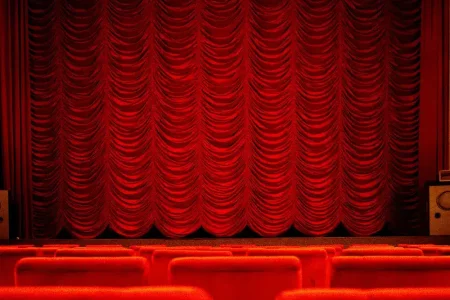 Red curtains on a stage for Theatres and Cinemas in Kent